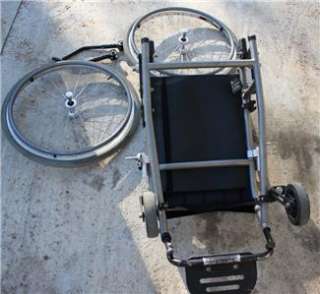 This auction is for an used Quickie Ti Titanium Wheelchair in good 