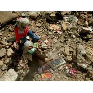  A Lebanese Woman Try to Salvage Some Belongings Amongst 