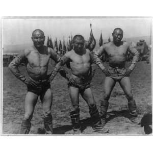  Three wrestlers of Ulan Bator posed standing with hands on 