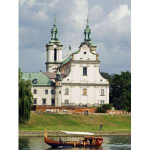 Church Overlooking Boat on Vistula River, Krakow, Poland Photographic 