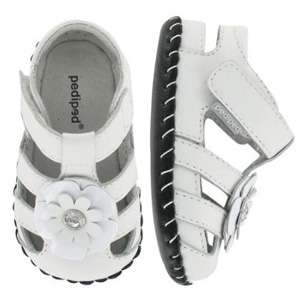 Closed toed sandal with a beautiful flower accent This classic white 