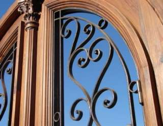 Arched double exterior door with solid wood and decorative iron insert 