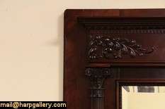   mantel and surround from about 1895 has baronial scale deeply sculpted