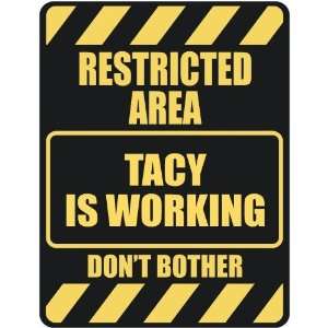   RESTRICTED AREA TACY IS WORKING  PARKING SIGN