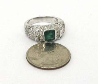 this is an elegant 18k gold diamonds and columbian emerald band