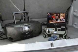 The Peak PKC0BO 400 Watt Tailgate Inverter powering multiple devices 