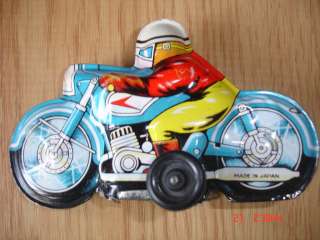 This is a vintage tin toy friction system motorcycle.Made in Japan 