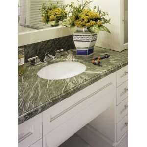 Bathroom Sink with Marble Countertop and Flowers in a Vase Premium 