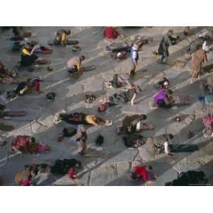  Tibetan Buddhist Pilgrims Prostrating Outside the Jokhang 